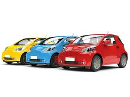 Modern compact urban electric cars in red, blue and yellow - closeup shot photo