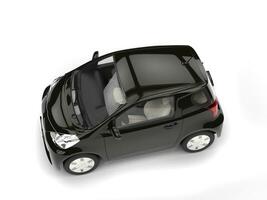 Black modern compact urban electric car - top view photo