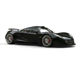 Metallic black modern supercar - studio shot photo