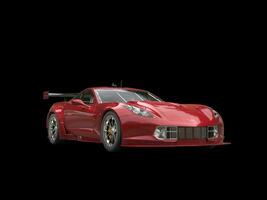 Dark red sports car - isolated on black background photo