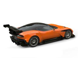 Black and orange modern sports super car - rear wing side view photo