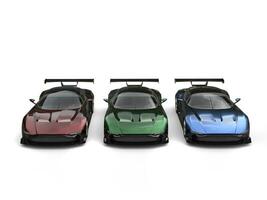 Modern metallic sports cars - red, green and blue - front view photo