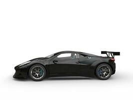 Jet black supercar - side view photo