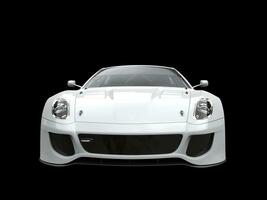 Clean white modern urban sports car isolated on black background photo