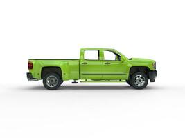 Modern bright green pickup truck - side view photo