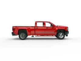 Modern red pickup truck - side view photo