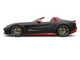 Cutting edge sports car - matte black with fiery red details - side view photo