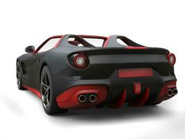Cutting edge sports car - matte black with fiery red details - back view photo