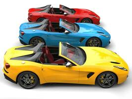 Red, blue and yellow modern convertible sports cars - side view photo