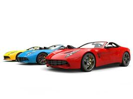 Red, blue and yellow modern convertible sports cars - beauty shot photo