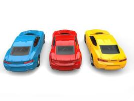 Red, blue and yellow modern fast cars - top down back view - 3D Illustration photo