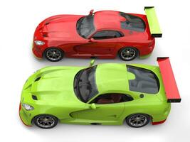 Raging red and crazy green super race cars side by side on start line - top view - 3D Illustration photo