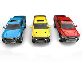 Red, blue and yellow modern pick-up trucks - top down front view photo