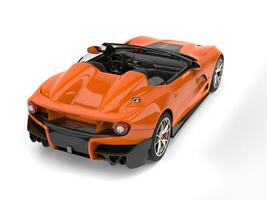 Fire orange modern convertible super sports car - back view photo
