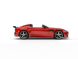 Rich red convertible sports car - side view photo