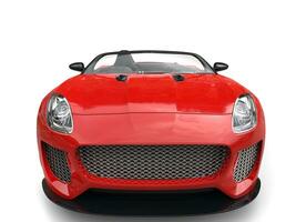 Modern fast raging red convertible  sports car - front view closeup shot photo