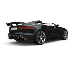 Black fast super sports car - back view studio shot photo