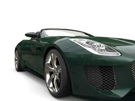 Forest green modern cabriolet sports car - headlight closeup shot photo