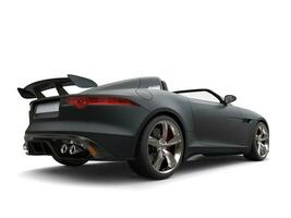 Stunning matte jet black modern convertible sports car - back view photo