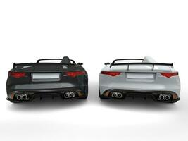 Extraordinary black and white modern convertible sports cars - back view photo