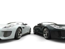 Extraordinary black and white modern convertible sports cars - closeup shot photo