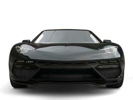 Awesome jet black modern sports car - front view closeup photo