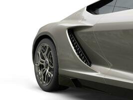 Dark gray modern sports car - rear wheel closeup shot photo