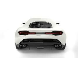 Snow white sports car - back view photo