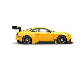 Awesome modern yellow race super car - side view photo