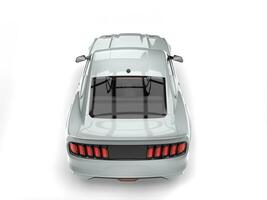 Super silver urban muscle car - top down back view photo