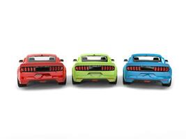 Red, green, and blue american muscle cars - back view photo