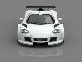 Racing car - white - on gray reflective background photo