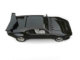 Jet black eighties sports car - top down view photo