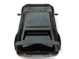 Pitch black eighties sports car - top back view photo
