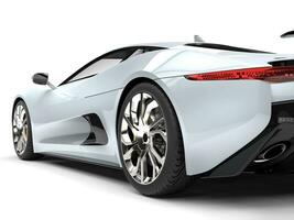 Elegant white super sports car - rear wheel closeup shot photo