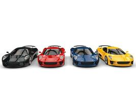 Modenr super sports cars - black, red, blue and yellow - front view photo