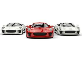 Awesome sports cars - red and white side by side - front view photo