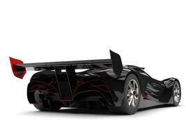 Gunmetal black racing super car with red details - tail view photo