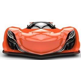 Vivid orange concept racing super car - front view closeup shot photo