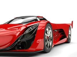 Scarlet red awesome race super car - headlight beauty shot photo