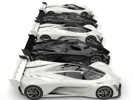 Awesome futuristic concept sports cars - black and white - side view photo
