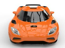 Flame orange luxury modern sports concept car - front view closeup shot photo