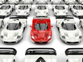 Stunning red modern concept sports car stands out in a sea of white sports cars photo