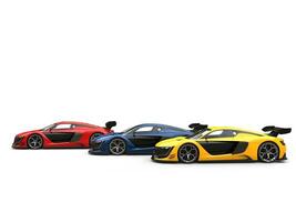 Red, blue and yellow supercars - red one in the front - side view photo