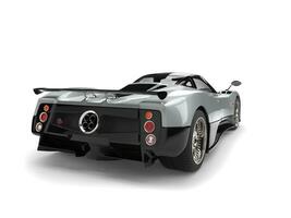 Luxury modern sports car - silver with black side panels - back view photo