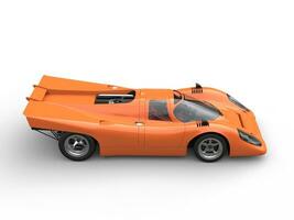 Cadmium orange vintage race super car - side view photo