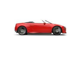 Raging red modern convertible sports super car - side view photo