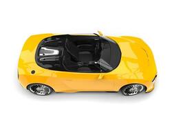 Sun yellow modern convertible sports car - top side view photo