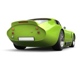 Luminescent green vintage sports car - tail view photo