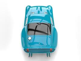 Subtle turquoise vintage sports car - top view photo